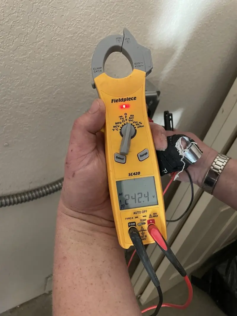 Voltage testing with clamp meter during Generator Installation in Manlius